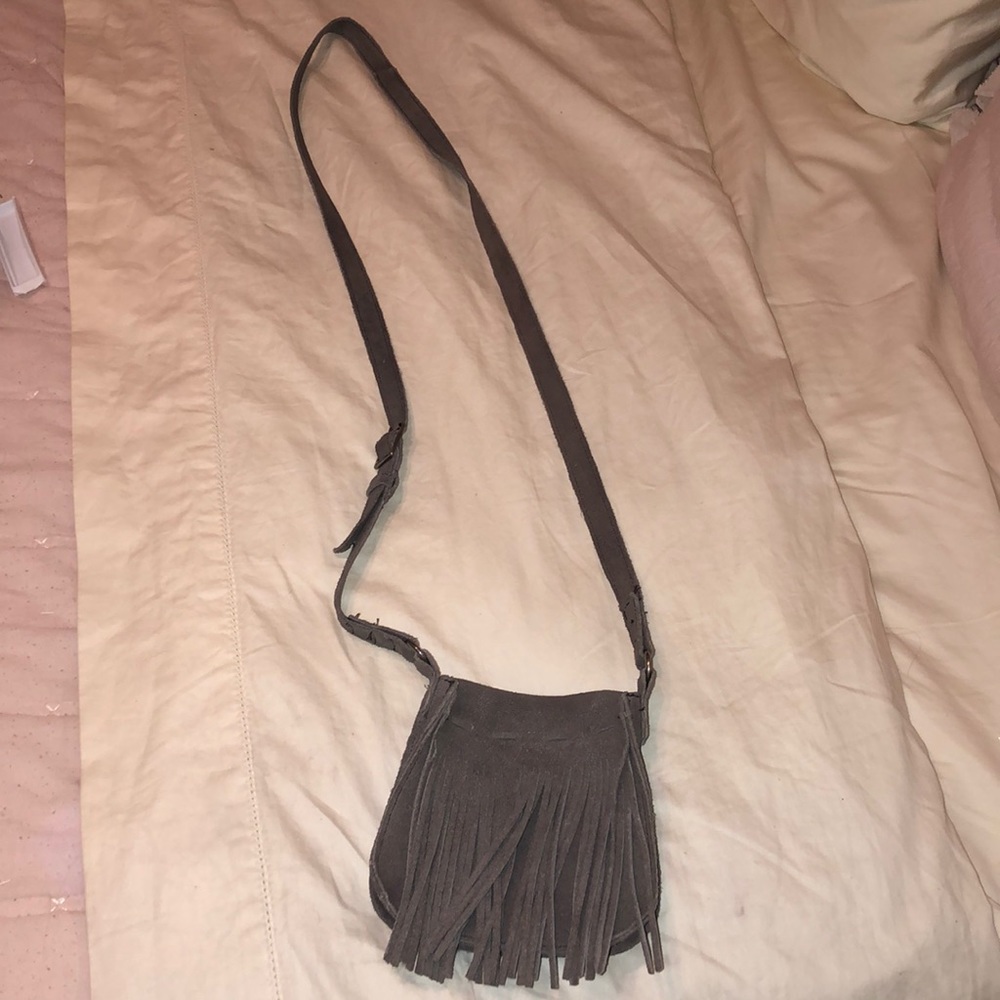 Fringe snap closure crossbody purse